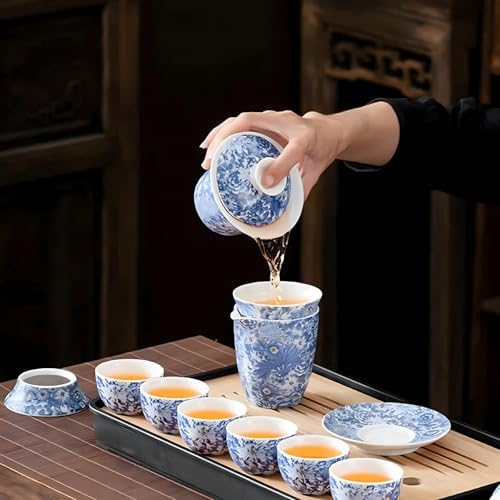 Pouring tea from blue-and-white porcelain gaiwan