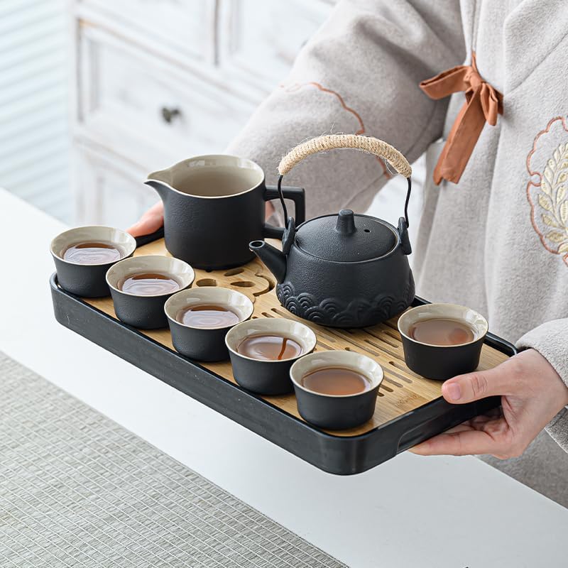 Gray tea set served on bamboo tray