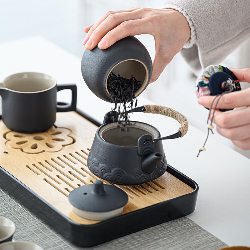 Color-changing tea pet beside a dark ceramic teapot